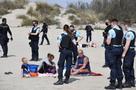 cobide masques golem plage sable controle police testation confinement gouttes veran